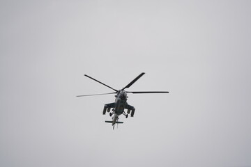 Almaty, Kazakhstan - 04.14.2022 : A military helicopter flies over the training ground during an exercise.