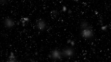 Fototapeta na wymiar Falling snow isolated on black background. Falling snow at night. Bokeh lights on black background, flying snowflakes in the air. Winter weather. Overlay texture.