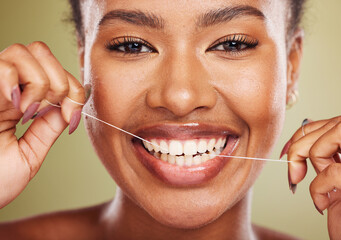 Black woman, teeth and smile for dental floss, skincare or cosmetic treatment against a studio...