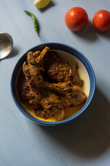 Popular Indian food chicken kasha or chicken in gravy in a bowl. View from top.