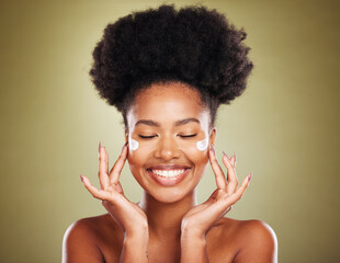 Cream, face and skincare black woman in studio for beauty, skin glow and shine for wellness goals,...