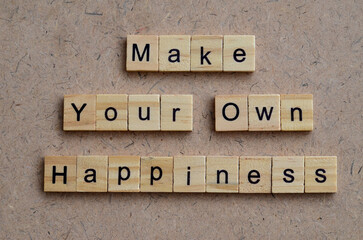 Make Your Own Happiness text on wooden square, business quotes