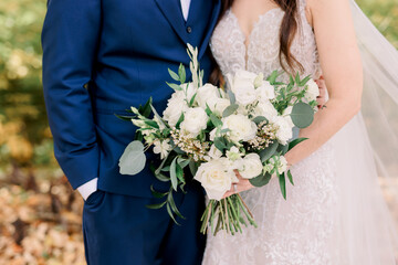 bride and groom with bouquet