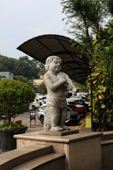 a very beautiful cupid statue