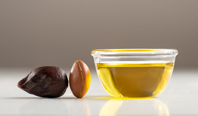 Argan seeds and oil close up