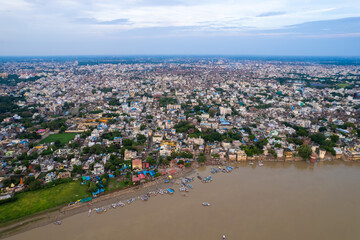Fototapeta na wymiar Aerial view of Varanasi city with Ganges river, ghats, the houses in Varanasi, Banaras, Uttar Pradesh, India