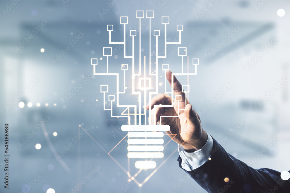 Aufkleber male hand working with virtual creative light bulb with chip hologram on blurred office background, 