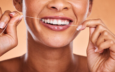 Woman, hands and teeth with smile for dental floss, skincare or personal hygiene against a studio...