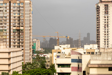 A skyline of modern concrete high rise skyscrapers in the suburb of Kandivali East in the city of Mumbai.