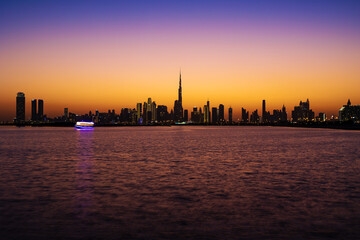 Fototapeta na wymiar Night view of Dubai Skyline buildings. A shot of Dubai Skyscrapers a view from Jaddaf walk.