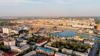 Fototapeta na wymiar Yoshkar-Ola, Russia. City center during sunset. Embankment of the river Malaya Kokshaga, Aerial View
