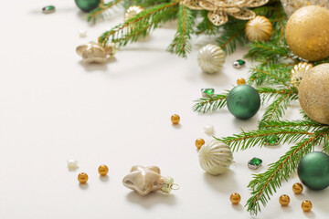 golden and green  christmas decorations  on white  background