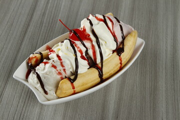Banana split in a wood table