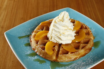 Waffles with peaches and whipped butter