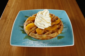 Waffles with peaches and whipped butter