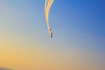 picture planes at the air show and trace from the planes and sky over the Persian Gulf, on the day of celebration of the Independence Day, Dubai, UAE