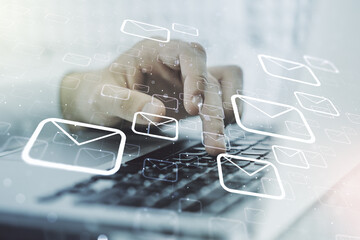 Creative concept of postal envelopes illustration with hands typing on laptop on background. Email and communications concept. Multiexposure