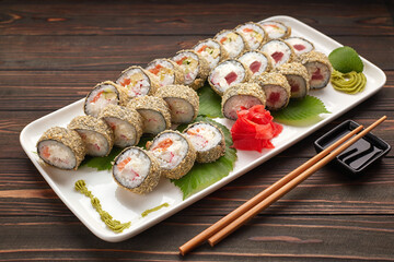 Sushi set on a wooden background with ginger