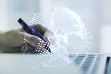 Double exposure of graphic America map and hand writing in notepad on background with laptop, big data and digital technology concept