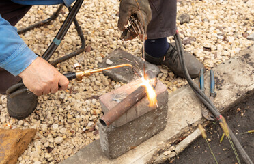 Gas welding of metal at the construction site.