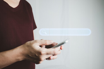 Search Engine optimization SEO concept, Businesswoman is using smartphone to search for information on Internet, Using the search bar, Wireless Network, big data and accessing website information.