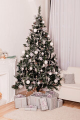 Beautiful Christmas tree in the home interior. Christmas Gifts