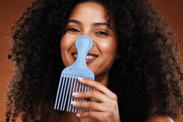 Black woman, curly hair comb and afro beauty, hairstyle and hair care on studio background. Portrait happy african girl model, hair brush or hair styling tool in fashion, cosmetics and natural trends - obrazy, fototapety, plakaty