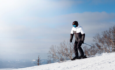 a man on skis is going down a snowy mountain
