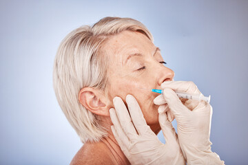 Botox, beauty and senior woman in a studio with a beautician for cosmetic anti aging treatment....