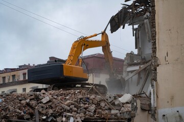 Batumi, Georgia - November 5, 2022: An excavator destroys an old house
