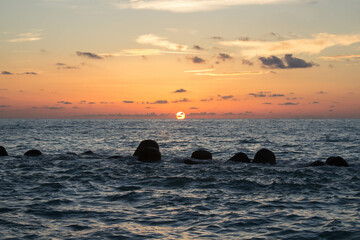 Fototapeta na wymiar evocative image of sunset over the calm sea on a beautiful day