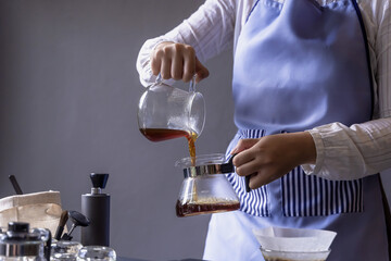 Coffee Barista pouring espresso coffee ready to serve in coffe shop