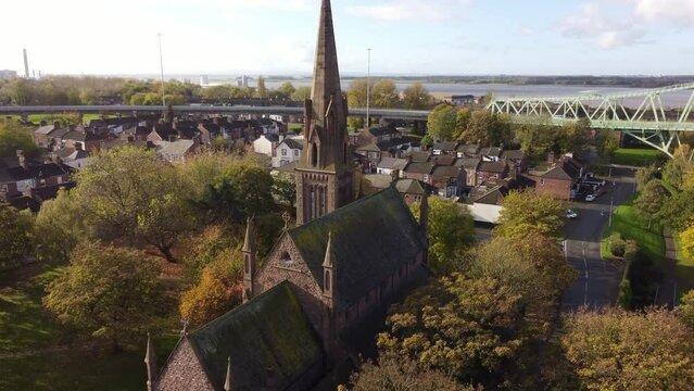 Old town Runcorn All saints church in suburban townhouse residential district aerial view push in