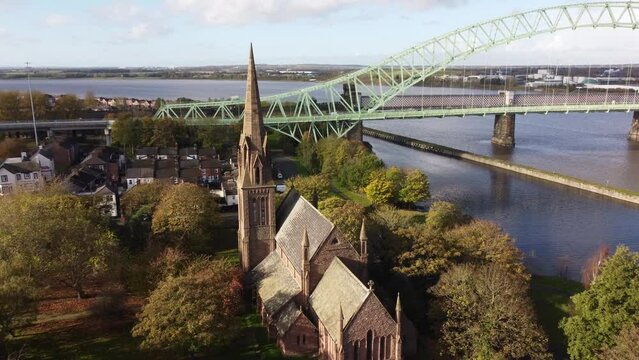 Old town Runcorn All saints church in suburban townhouse residential district aerial view towards steeple