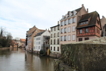 Naklejka na ściany i meble Old houses, leaning out, on a canal of the river Rhine in Strasbourg