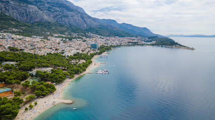 Naklejka premium Turquoise sea and stone beach by pine trees view, Dalmatia, Croatia