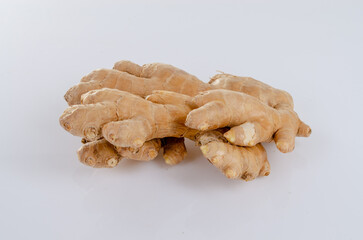 Ginger root on white background with reflection