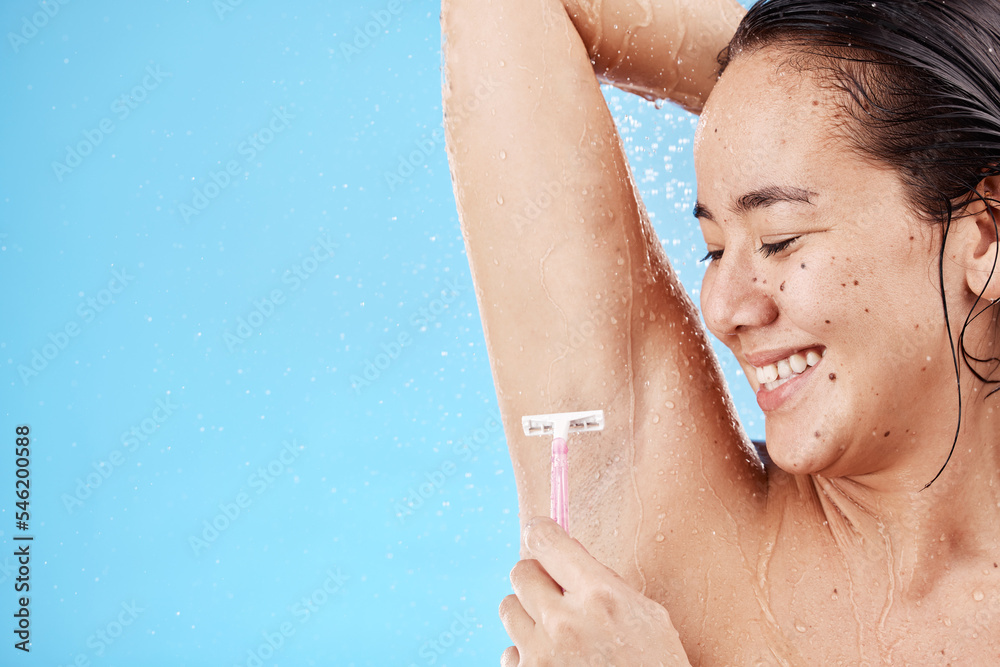 Sticker Shower, underarm and shaving with a model asian woman shaving her armpit in studio on a blue background for grooming. Water, luxury and hair removal with an attractive young female in the bathroom