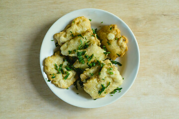 The Mendoans, a traditional food from soybean with flour, served in white plate