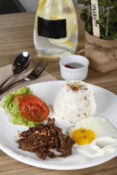 Tapsilog, a Filipino breakfast of beef tapa, fried rice and eggs