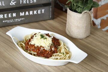 Meaty spaghetti with grated cheese on top