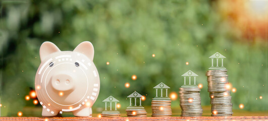 Close-up of stacked coins against green bokeh background. business concept finance and money Save money to prepare for the future. Saving money for the future