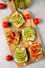 Vegetarian toast with avocado and tomatoes