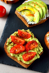 Vegetarian toast with avocado and tomatoes