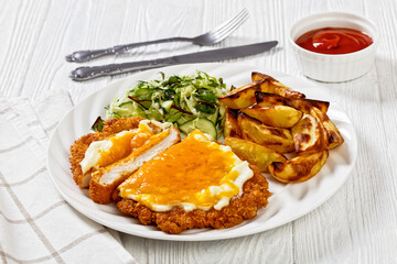 chicken parmo with coleslaw and roast potatoes