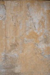 Old yellow grey wall with chipped paint, texture, background