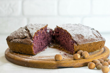 Homemade cake with raspberries and hazelnuts, a traditional sweet recipe