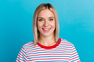 Fototapeta premium Portrait of good-looking caucasian woman laughing standing against blue background. Positive Fashionable girl