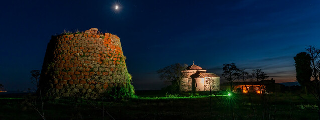 Night view of the Nuraghe and Church of Santa Sabina, located in the municipality of Silanos, Nuoro - Sardinia