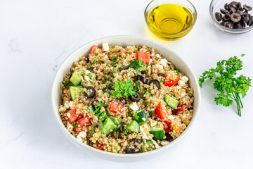 Healthy Quinoa Salad in a Bowl Top Down Close Up Photo on White Background